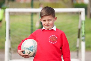 child-holding-ball